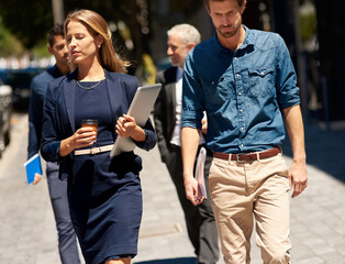 Walking, group and business people in city, travel and accounting with discussion. Employees, cooperation and coworkers with commute, morning and start day with advice, journey and financial agency