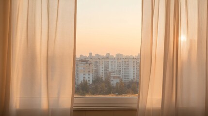 City sunrise view through sheer curtains