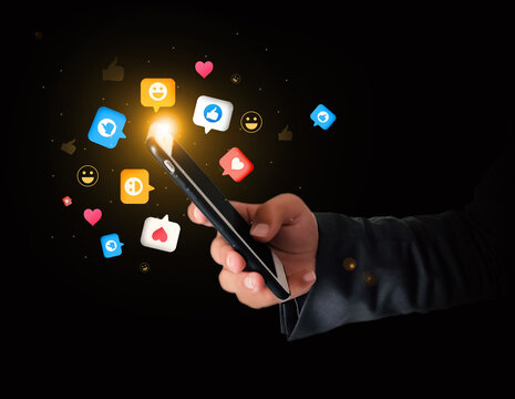 Social Media Likes and reactions concept background hovering around the mobile phone. Thumbs up with hearts floating around the smartphone, likes, smile, social media concept - Powered by Adobe