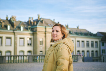 Outdoor portrait of mature 40 - 45 year old woman, wearing warm jacket