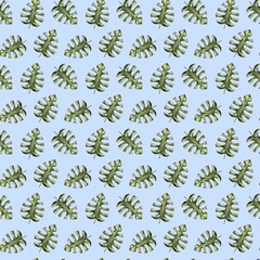 Watercolor leaves pattern in green on a light blue background for textile and packaging design