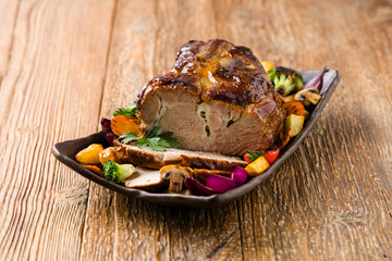 Whole roasted pork neck.