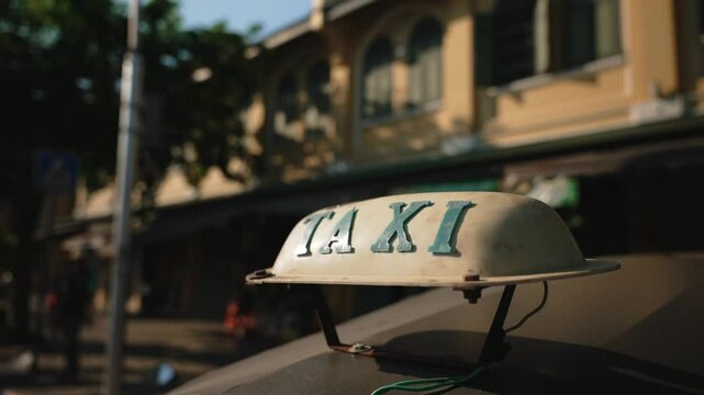 Close up of yellow tuk tuk taxi top roof light box on sunny day. Copy space famous concept of Bangkok