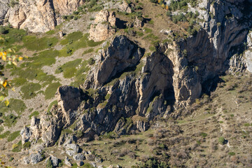 Unique rocky ridge with steep cliffs is whole gallery of picturesque landscapes. Rocky mountains with trees growing on them amaze with their natural beauty. Chegem Gorge. Kabardino-Balkaria. El-Tyubu.