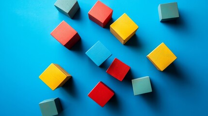 Obraz premium modern business segmentation visual, floating organic shapes, dimensional cube arrangement, bold tricolor design, abstract team representation, geometric minimalism, azure blue backdrop, conceptual