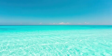 Serene turquoise ocean waters meeting a vibrant blue sky, a picturesque summer seascape