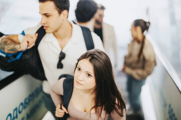 A group of students interacting with their professor outdoors, showcasing educational engagement and youth energy on campus. The scene captures a dynamic and inspiring learning environment.