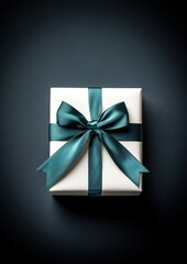 Elegant White Gift Box with Teal Ribbon on Dark Background
