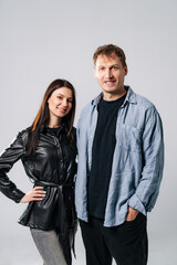 Young adults posing together. Two young adults stand together, smiling, dressed casually, highlighting their friendly and approachable demeanor.