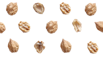 Walnuts falling on transparent background: whole and cracked nuts in freefall