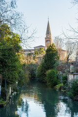 Naklejka premium view of the bell tower in the historic center of Portogruaro, Veneto, Italy