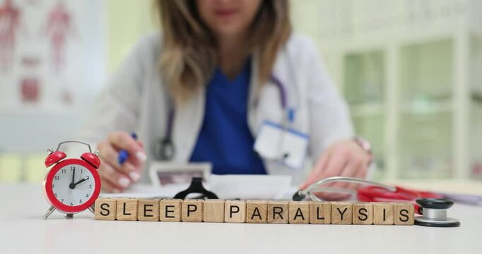 A healthcare professional studies sleep paralysis in a clinical setting, emphasizing awareness and research.