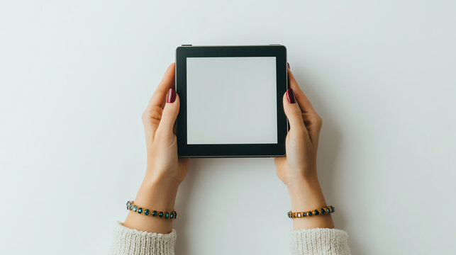 Honey skinned woman's hands tablet long crimson nails isolated white background elegant modern digital device stylish closeup photography pad sleek brown dark user wrist smart studio trendy screen
