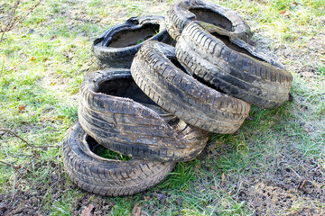 old tires in the nature pollution image
