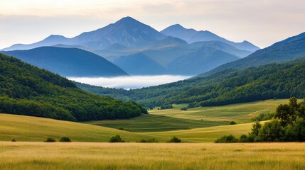 Obraz premium Mountains landscape nature idea. Breathtaking mountain view with lush green valleys and serene atmosphere.