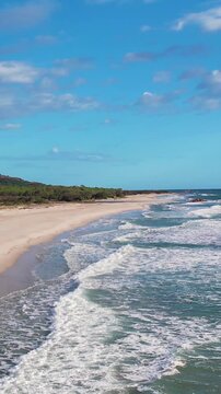 Aerial drone view on white sand Berchida beach of Sardegna. Warm turquoise sea and long beach on the Sardinia island.