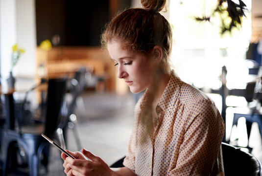 Woman, relax and tablet in cafe for reading, digital menu and platform for service review. Customer, tech and internet in coffee shop for ebook, social media and connectivity for travel networking - Powered by Adobe