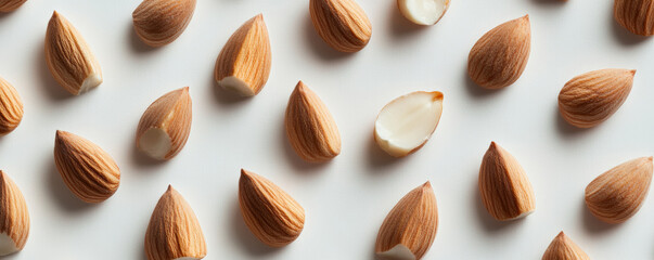 Close up of almonds arranged in geometric layout, showcasing their natural texture and color. This visually appealing composition highlights beauty of these nuts