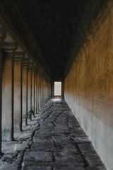 Obraz premium Ancient Stone Corridor Leading to Light