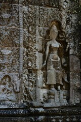 Intricate stone carvings at Angkor Wat temple.
