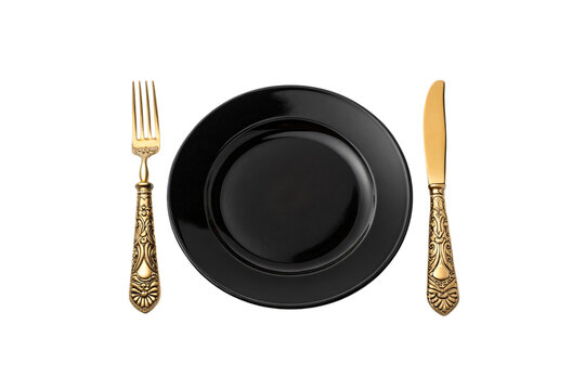 Glossy black plate paired with ornate gold-handled fork and knife. Luxurious dining setup combining modern simplicity with regal elegance, isolated on a transparent background