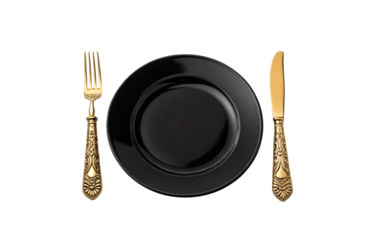 Glossy black plate paired with ornate gold-handled fork and knife. Luxurious dining setup combining modern simplicity with regal elegance, isolated on a transparent background
