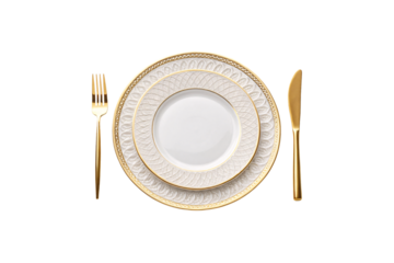 Luxurious dinner set featuring embossed gold designs on plates with matching gold flatware, combining traditional elegance with contemporary style, isolated on a transparent background