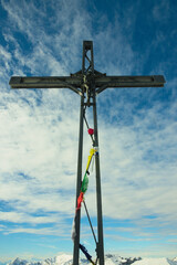 The cross at the top of Mount Venturosa. Bergamasque Prealps, Italy