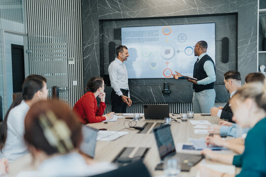 A diverse group of people gathered in a modern conference room, engaging in a collaborative meeting to brainstorm and analyze solutions, fostering teamwork and idea sharing.