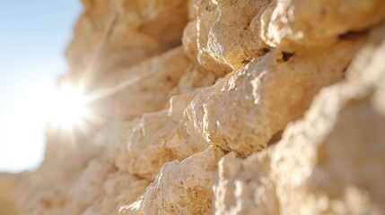 Obraz premium Sunlit limestone wall, coastal cliff, textured background