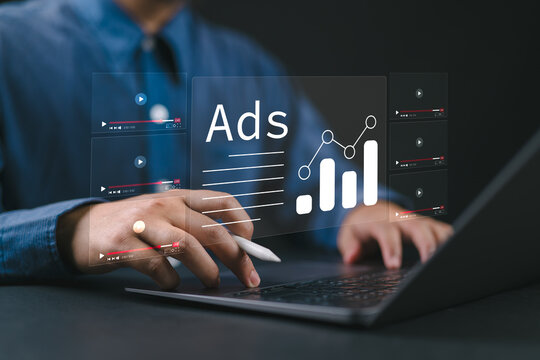 Digital Advertising Analytics and Video ADS Campaigns. Man using laptop analyzing digital ad performance metrics and campaign data. Digital marketing online, Content creation, Customer engagement,
