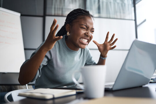 Black woman, laptop and stress with crisis in office with anxiety, email or rejection letter for architecture deal. Person, computer and frustrated with anger for news at property development agency