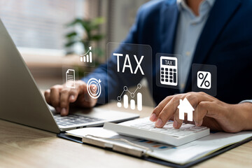 Tax and Vat concept. Government, state taxes concept. Businesman using calculator and laptop to...