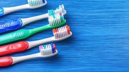Colorful Toothbrushes Arranged on Blue Background for Dental Care