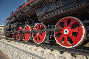 Wheels of an old locomotive. Chassis of a steam locomotive.