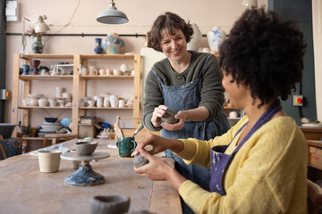 Friendly Artist teaching a Pottery class