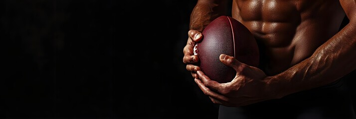 Football player man player holding american football on black blackboard texture background with copy space for text or design. Panoramic banner.