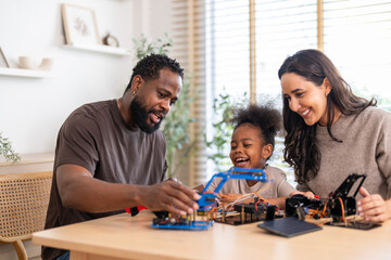 African love family, father mother and daughter learning STEM education, science experiment, robotics toy, technology and innovation interactive learning, creativity and development at home