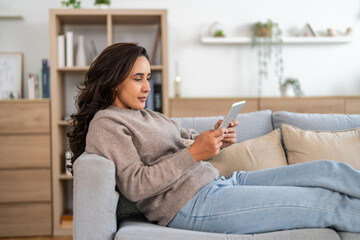 Young smiling  woman happy relax use tablet conference work,learning, education, shopping, study online webinar, online marketing, business, blog, digital internet advertising at home