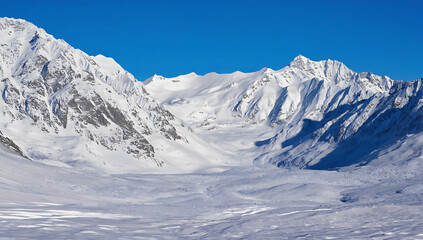 Snowy mountain peaks under blue sky