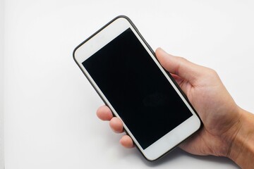 Hand holding Smartphone photo and isolated on white background for your mobile phone app or web site design, logo Global Business technology