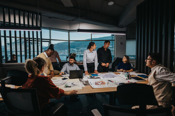 A diverse group of business colleagues brainstorming and strategizing on projects in a contemporary...