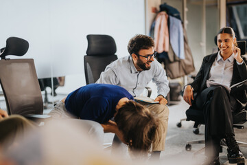 Cheerful group of business coworkers enjoying a laugh during a casual meeting. This lively office...