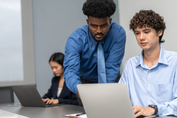 Diverse team brainstorming business meeting, professional presentation with data charts, team collaboration for project planning, modern corporate office teamwork, group discussing business strategies