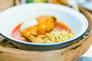 Northern Thai noodle curry soup with chicken