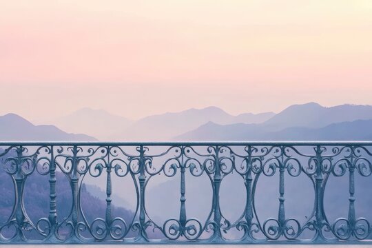 Ornate balcony railing overlooks a hazy mountain range at dawn, serene and peaceful.