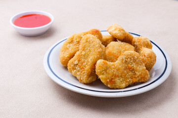 Crispy Chicken Nuggets with Spicy Dipping Sauce