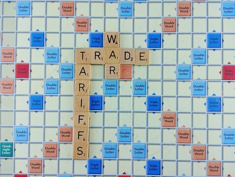 Tariffs trade war concept on a scrabble board. 03-02-2025
