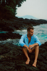man sitting on the beach