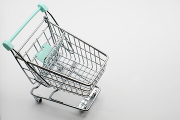 Empty cart from a store or supermarket. metal and chrome. isolated background. close-up. Element...